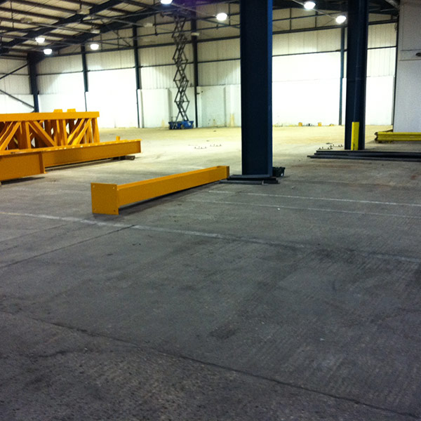 Yellow support beams on the concrete floor