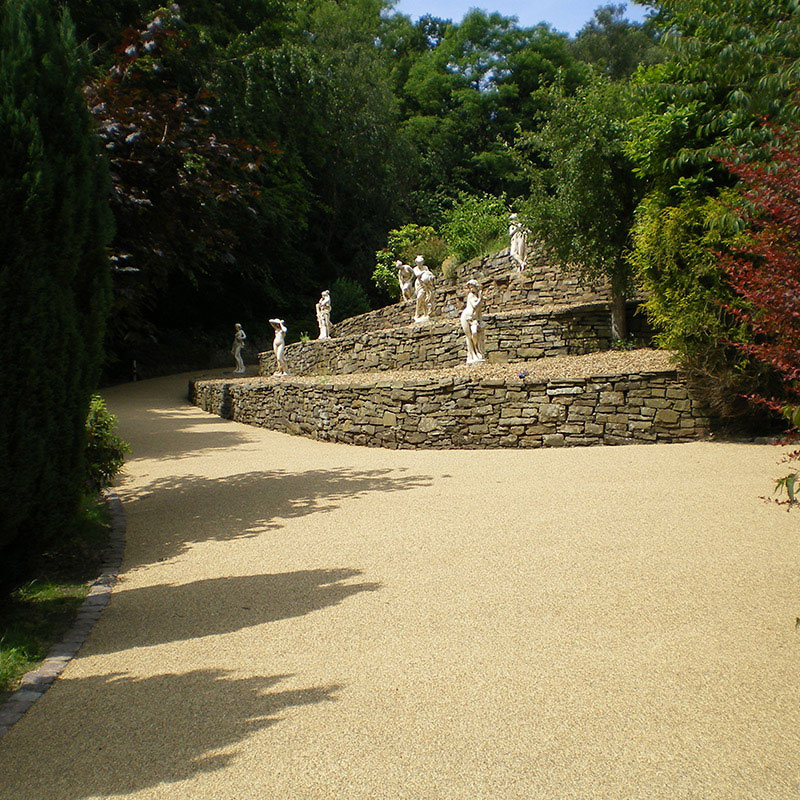Image of a long bending driveway using resin bound
