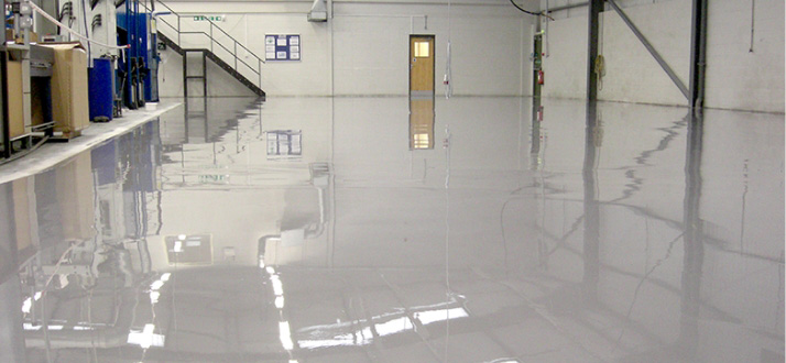 Shiny white resin floor in large warehouse