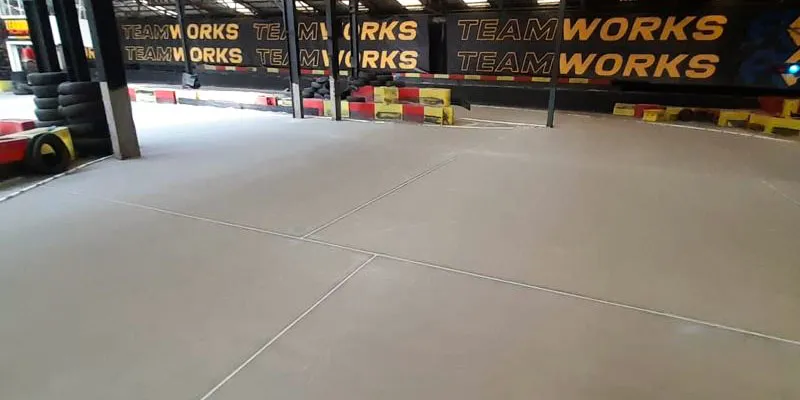 Pumped screed flooring laid in a racecourse warehouse.