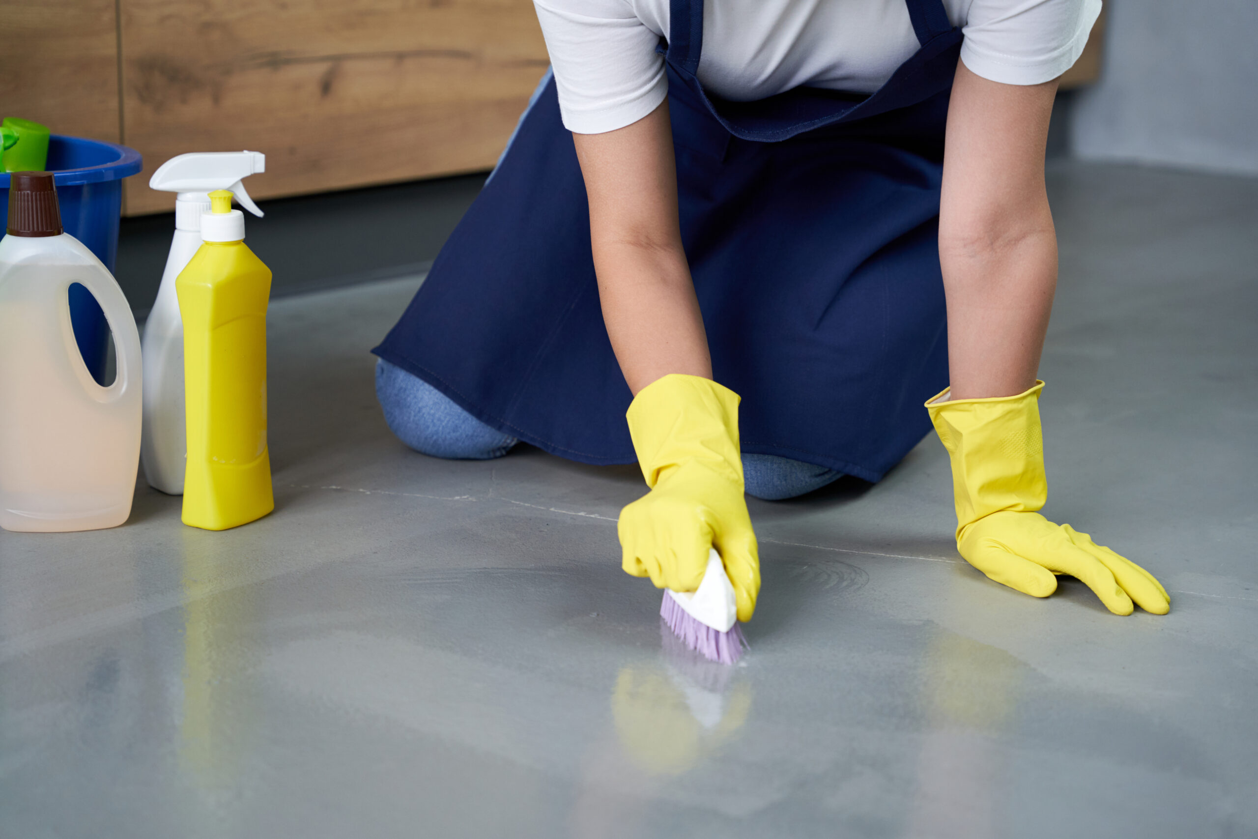 Woman cleaning epoxy flooring